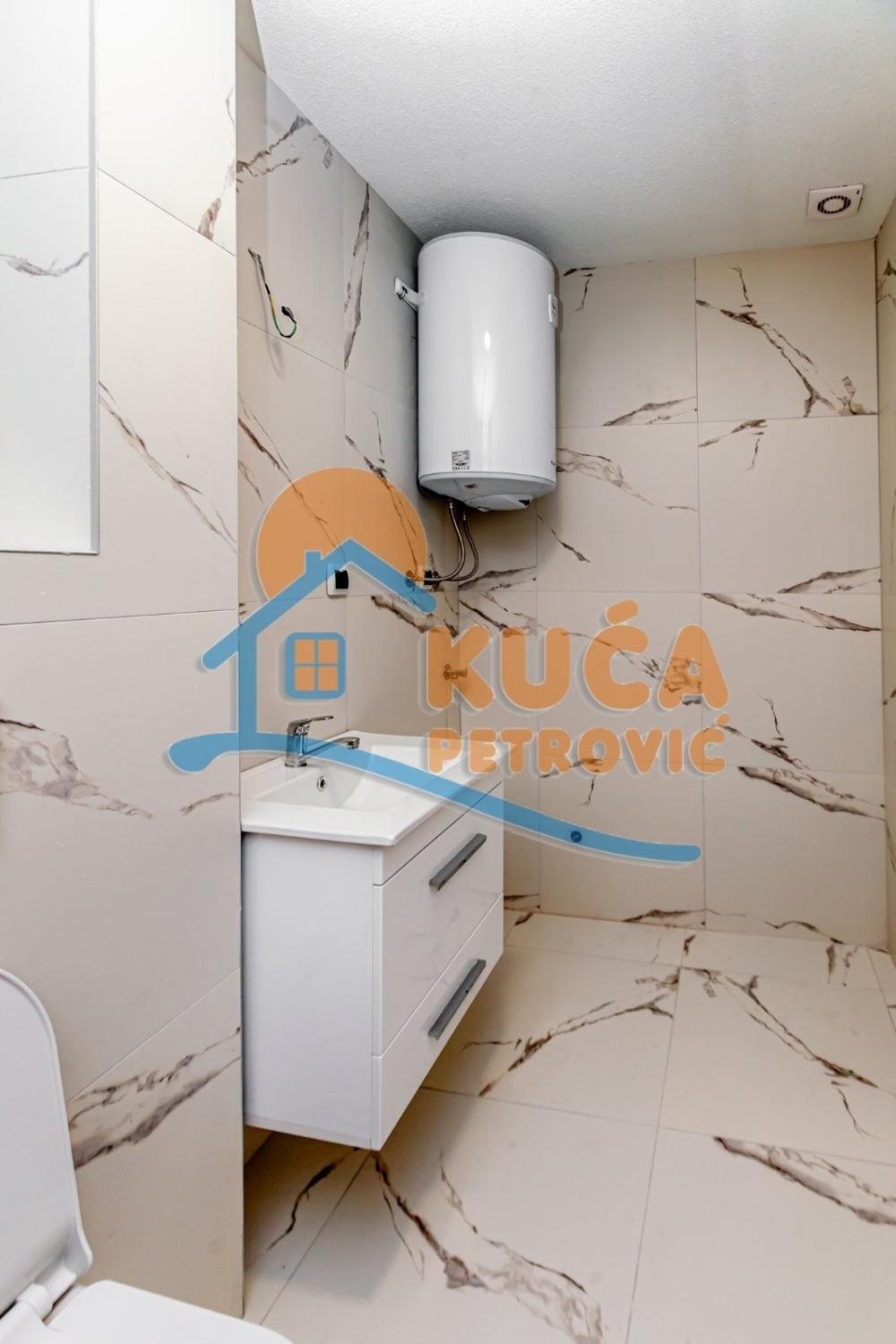 Slika 7 - Stan u zgradi, novogradnja, uknjižen, etažno grejanje, oglas ID p-015326