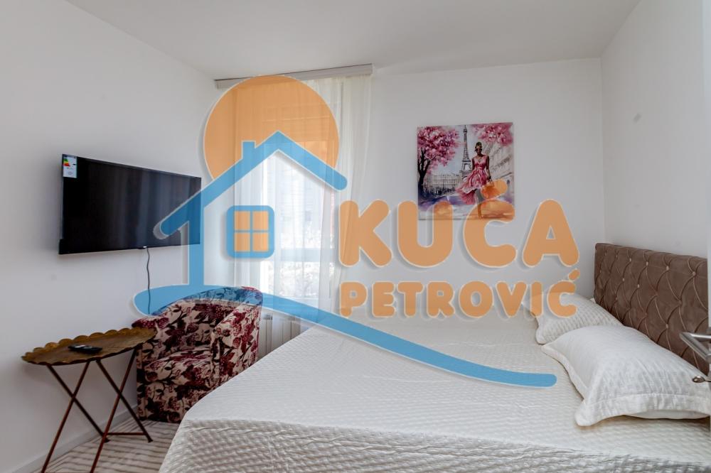 Slika 8 - Stan u zgradi, novogradnja, uknjižen, etažno grejanje, oglas ID p-015996