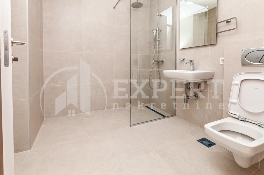 Slika 6 - Stan u zgradi, novogradnja, uknjižen, centralno grejanje, oglas ID p-015141